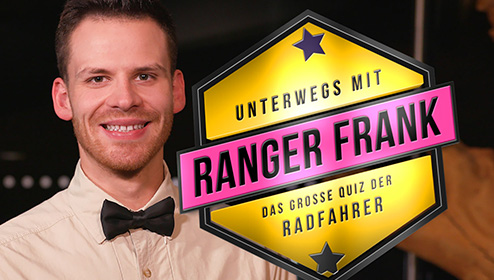 Portraitbild von Ranger Frank vor einem See im Wald